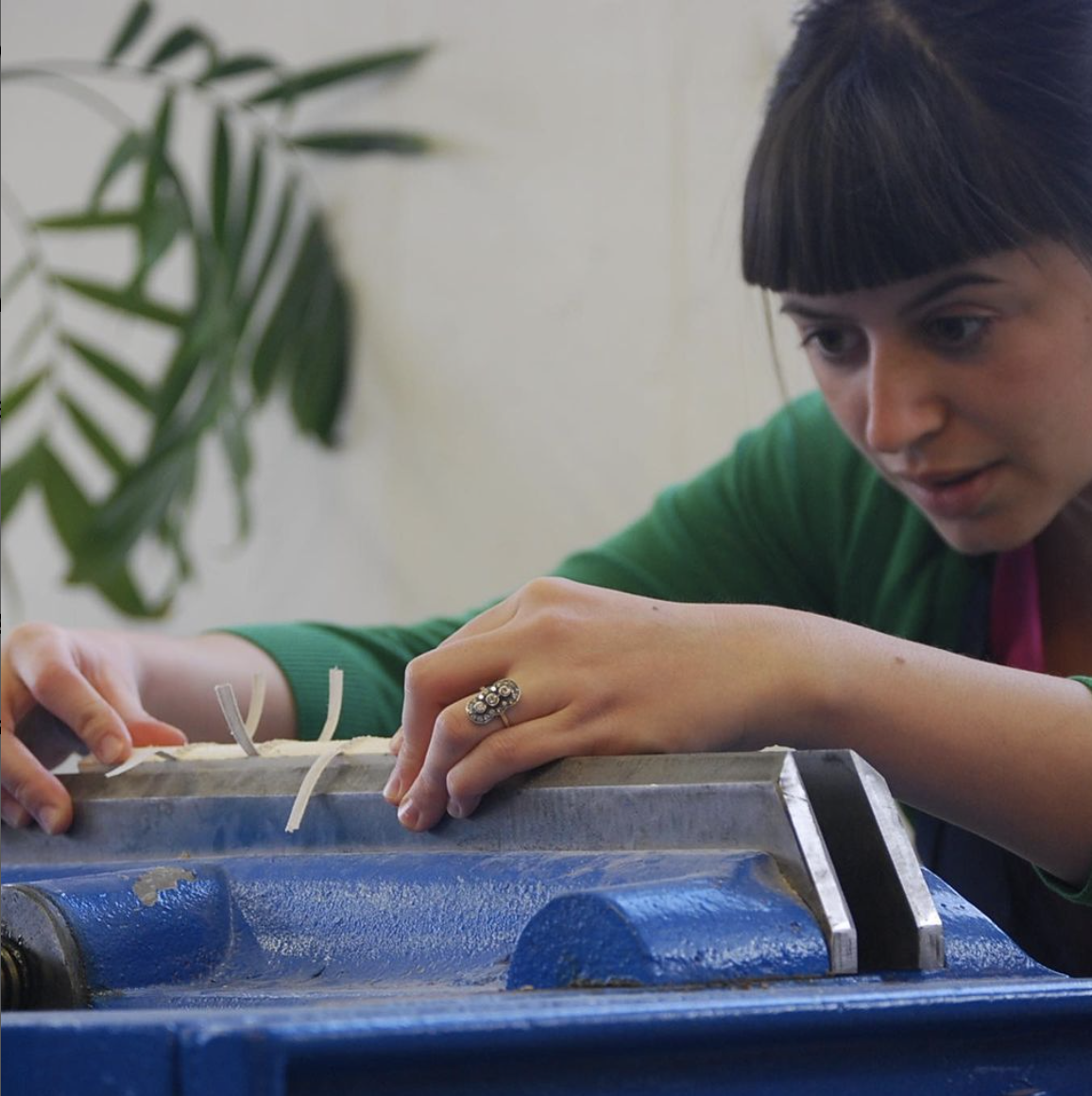 Photo of a woman binding a book