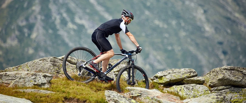 man on bike riding on a mountain