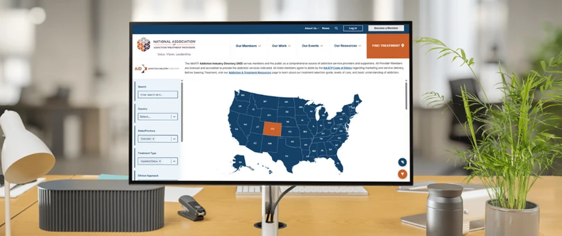 Computer monitor on desk showing map of the US