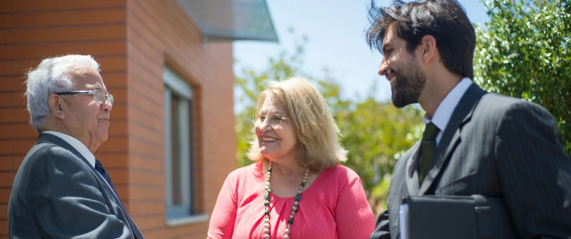 Homeowners shaking hands with a lending agent