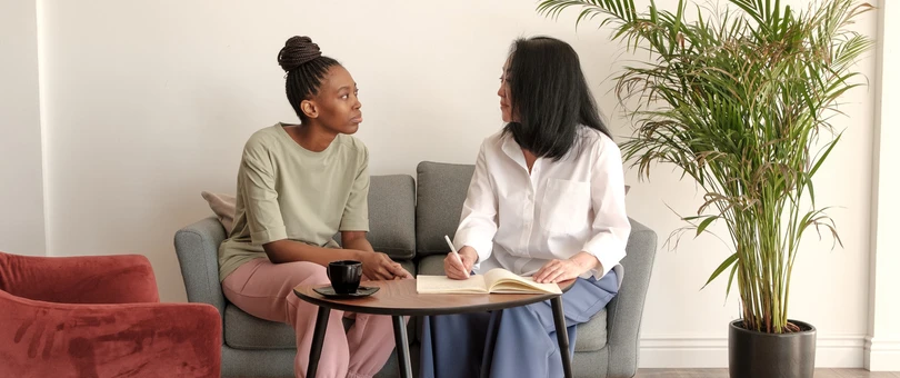 woman in therapy talking to a counselor