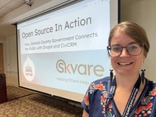 Gena Dellett presented at Drupal GovCon 2025 on "Open Source in Action", highlighting Johnson County Kansas' use of Drupal and CiviCRM